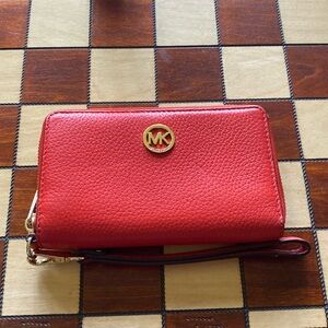 Michael Kors wallet wristlet, barely used no scratches or distress, pink-red.